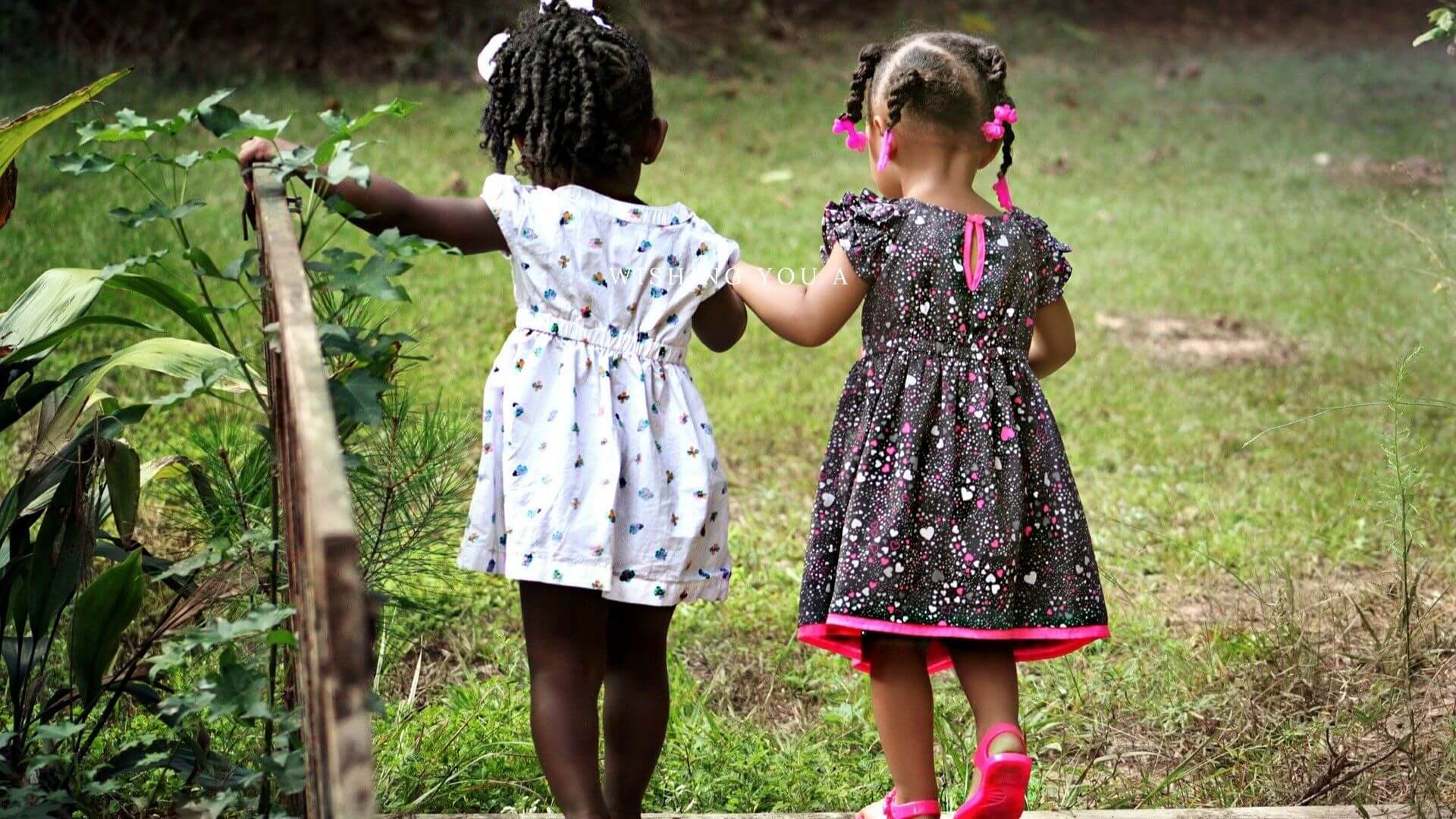 friends walking and holding each other hand